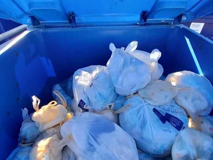 diaper waste in blue container